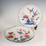 A pair of Chinese porcelain Imari dishes, Qing Dynasty, decorated with fenced gardens of rockwork