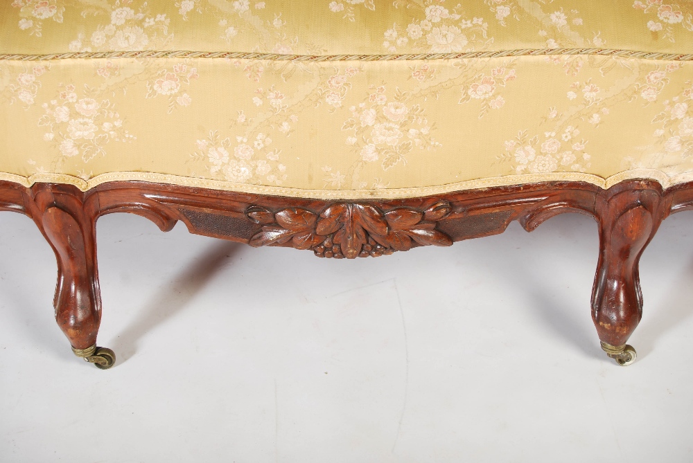 A Victorian mahogany sofa, the top rail carved and pierced with flowers and foliage above a back - Image 5 of 6