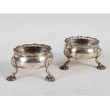 A pair of George III silver salt cellars, London, 1764, makers mark R over DHH, circular with