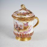 A Meissen porcelain cup and cover, 19th century, decorated in the 18th century style with harbour