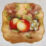 A Royal Worcester hand painted square shaped dish, dated 1934, decorated with apples and grapes on a