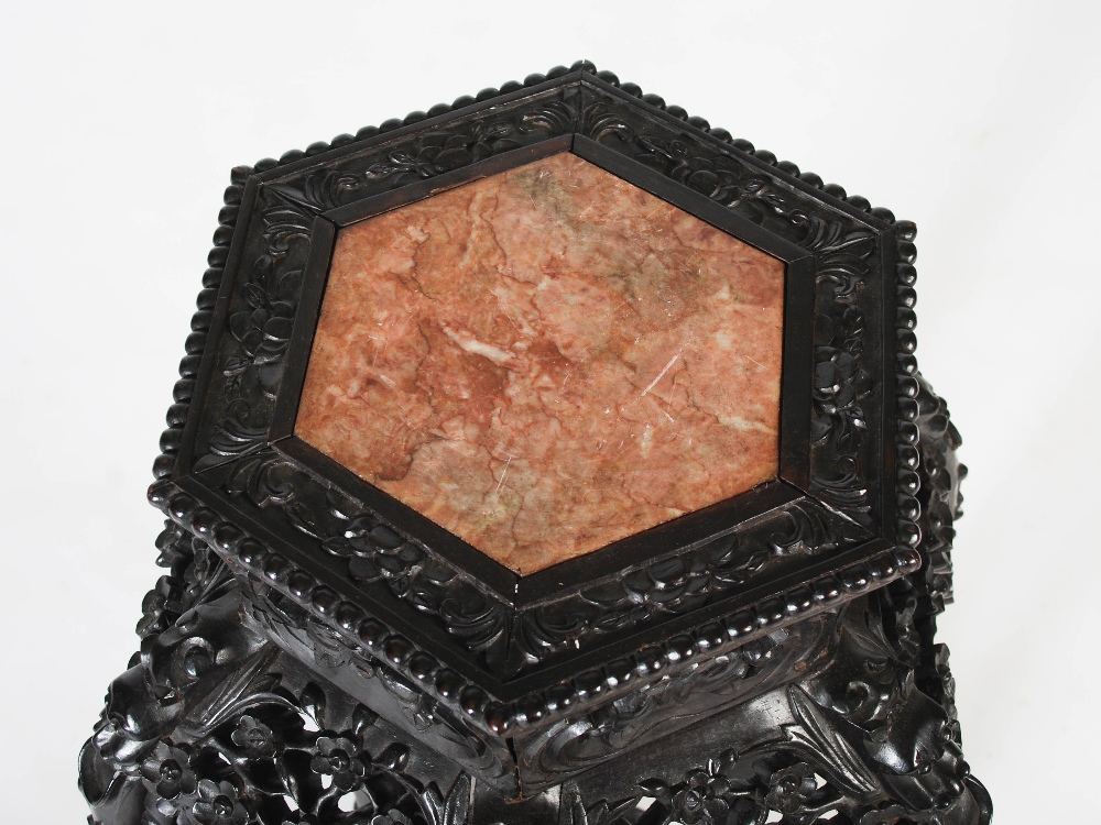 A Chinese dark wood hexagonal shaped jardiniere stand, Qing Dynasty, the shaped top with a mottled - Image 2 of 4