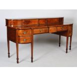 A Scottish George III mahogany and boxwood lined sideboard, the stage back with two sliding doors on