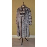 A full length Silver Fox fur coat, size 12.