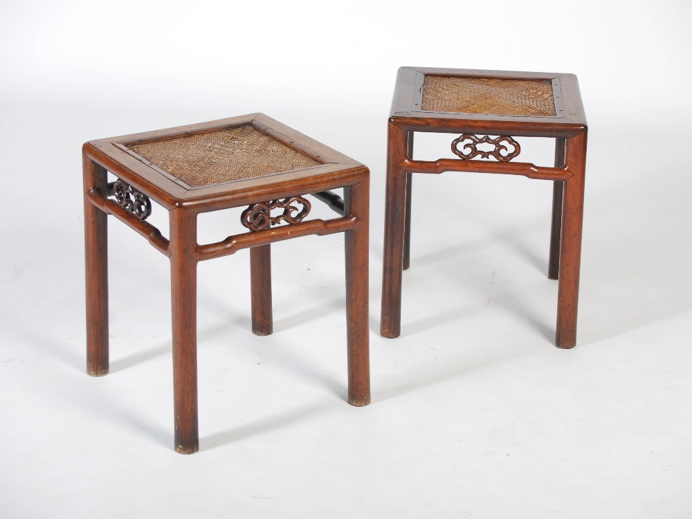 A pair of Chinese dark wood square shaped jardiniere stands, Qing Dynasty, the square shaped tops