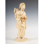 A Japanese ivory okimono of mother and child, Meiji Period, signed, 18.5cm high.