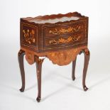 A 19th century Dutch mahogany and marquetry inlaid bow front bedside table, the rectangular top