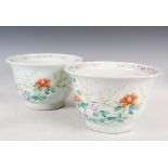 A pair of Chinese porcelain famille rose jardinieres, Qing Dynasty, decorated with peony and