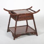 A Chinese dark wood occasional table of architectural form, the square panelled top above a single