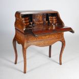 A 19th century Continental rosewood and marquetry inlaid bureau, the hinged fall front inlaid with a