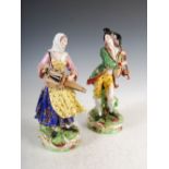 A pair of early 19th century Derby porcelain figures of male and female musicians, red painted crown