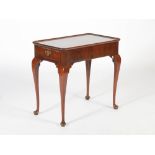 A 19th century mahogany silver table, the slightly dished rectangular top with re-entrant corners,