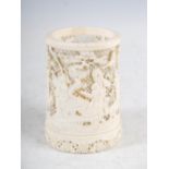 A Chinese ivory brush pot, Qing Dynasty, carved with figures, pavilions and pine trees on a finely