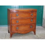 A 19th century mahogany and boxwood lined bachelor's bow front chest, the shaped top above a brush