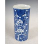 A Chinese porcelain blue and white cylindrical vase, Qing Dynasty, decorated with prunus blossom