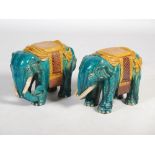 A pair of Chinese pottery elephants, late 19th/ early 20th century, ochre and turquoise glazed, 37cm