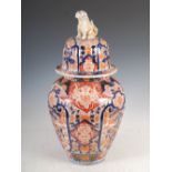 A large Japanese Imari jar and cover, Meiji Period, the fluted body decorated with panels of