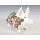 A Wemyss pottery pig, decorated with roses and foliage, green painted mark, 27cm high x 43cm long.