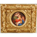 A late 19th/ early 20th century Continental porcelain plaque after Raphael's Madonna Delia Sedia, in