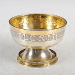 A George V silver gilt footed bowl, Chester, 1925, makers mark of S.B. Ltd, chased with motto '