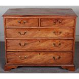 A George III mahogany chest, the rectangular top with a moulded edge above two short and three long