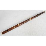 A 19th century boxwood and ivory six key Patent flute, London, maker's mark obscured 66.5cm long.