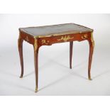 A late 19th/early 20th century mahogany and gilt metal mounted writing table in the Louis XV style