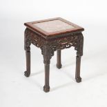 A Chinese dark wood jardiniere stand, Qing Dynasty, the square shaped top with a mottled red and