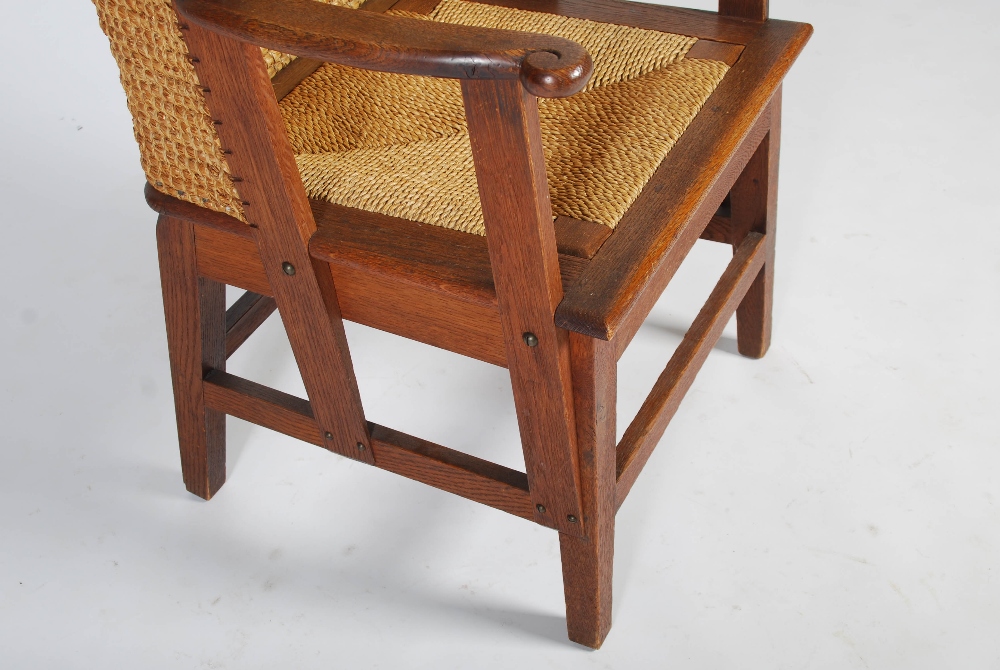 A late 19th/early 20th century oak Orkney chair, with woven back and woven drop in seat, raised on - Image 5 of 6