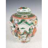 A Chinese porcelain famille verte jar and cover, Qing Dynasty, decorated with warriors, double