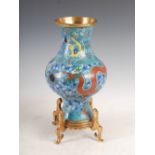 A Chinese blue ground cloisonne vase, late Qing Dynasty, decorated with dragons contesting a flaming
