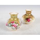 A near pair of Royal Worcester hand painted vases, dated 1909 and 1913, one painted with red and