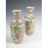 A pair of Chinese porcelain famille verte crackle glazed vases, Qing Dynasty, decorated all around