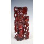 AMENDMANT, NOT AMBER AS CATALOGUED BUT SIMULATED AMBER - A Chinese amber figure of sage and