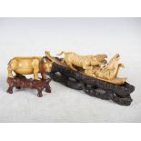 Two 19th century Indian ivory carvings, comprising; tiger and stag group on carved and pierced