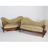 A pair of early 19th century mahogany sofas, the shaped upholstered backs and seats with scroll