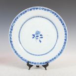 A Chinese porcelain blue and white circular dish, late Qing Dynasty, decorated with peony spray