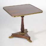 A 19th century rosewood and brass inlaid occasional table in the Regency style, the rounded