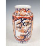 A Japanese Imari vase, late 19th/early 20th century, decorated with shaped rectangular panels of