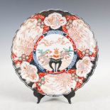 A Japanese Imari charger, late 19th/early 20th century, decorated with a central roundel enclosing