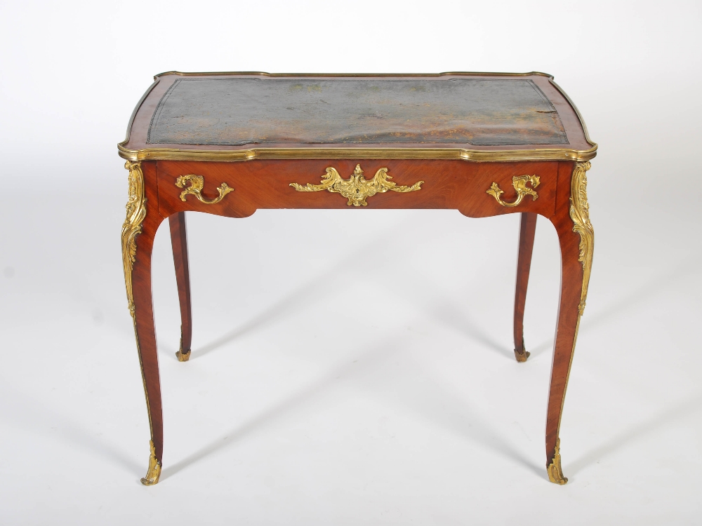 A late 19th/early 20th century mahogany and gilt metal mounted writing table in the Louis XV style - Image 2 of 6