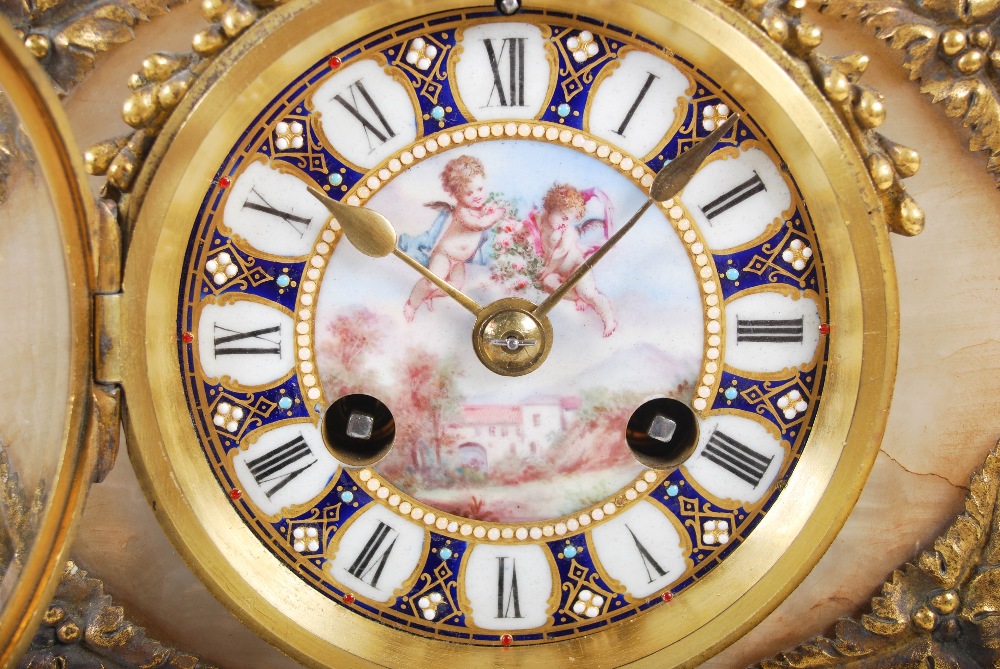 A late 19th century French onyx ormolu and porcelain mounted mantel clock, the blue ground porcelain - Image 4 of 7