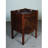 A George III mahogany tray top commode, with a pair of cupboard doors above a pull out section.