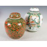 A Chinese porcelain famille verte jar and cover, decorated with figures in formal and diaper