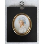 Romington, a portrait miniature of a lady, framed oval, signed lower right, 7cm x 6cm.