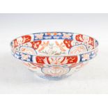 A Japanese Imari bowl, late 19th/early 20th century, the interior decorated with a circular panel of