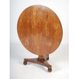A 19th century rosewood snap top supper table, the hinged circular top with a beaded border,