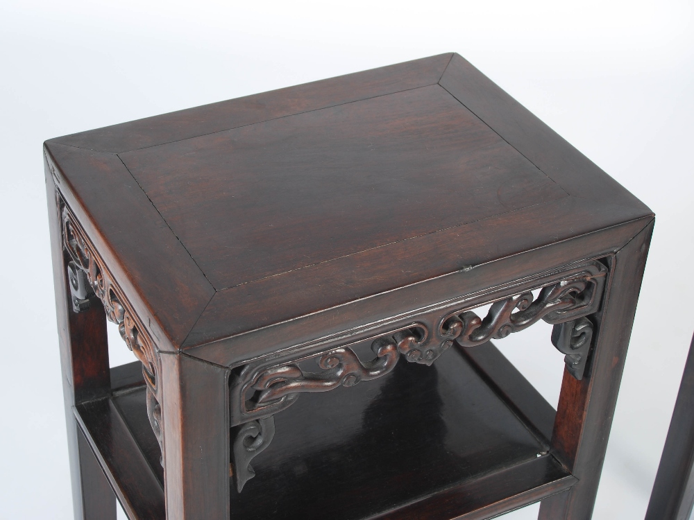 A pair of Chinese dark wood jardiniere stands, Qing Dynasty, the rectangular panelled tops above - Image 3 of 4