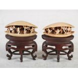 A pair of Chinese ivory clam shells, Qing Dynasty, the interiors carved with figures, pine trees and