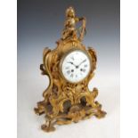 A late 19th century French Rococo style ormolu mantel clock, the circular dial with Arabic and Roman